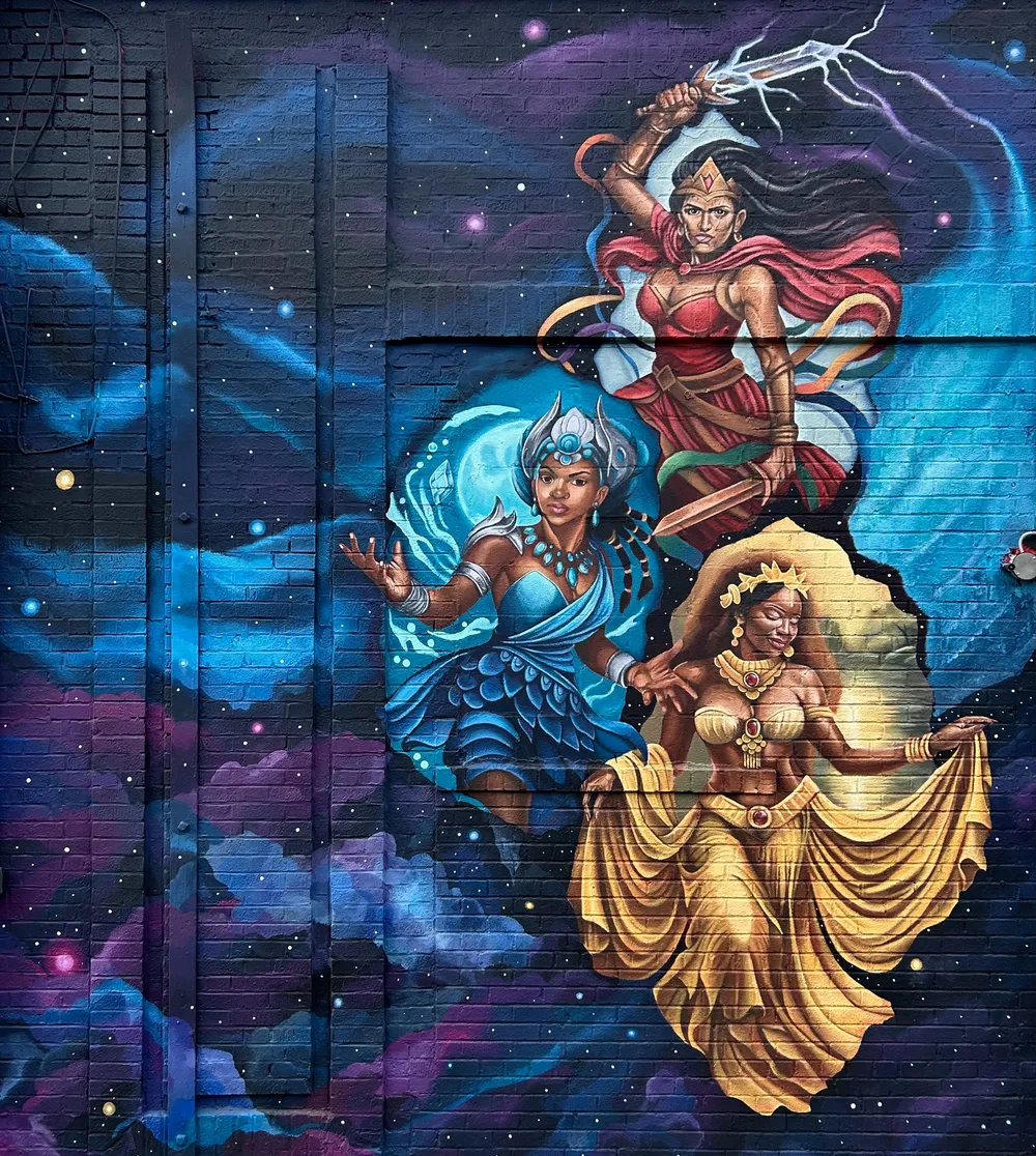 Colorful mural of mythological and comic characters